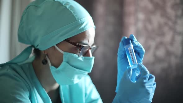 Conceptual video of a doctor holding a recipient with the coronavirus COVID-19 vaccine.