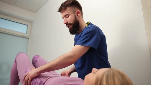 Physical Therapist Doing Mobilisation Spine Girl s Pelvis Being Manipulated alt