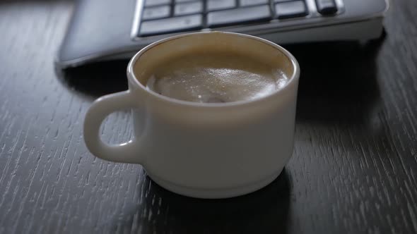 Work finishing and taking coffee cup high definition 1080p FullHD slow-mo   footage - Typing and mak