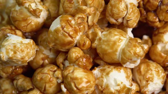 Coffee taste popcorns rotating close up. Caramel popcorn. Healthy food for morning breakfast alt