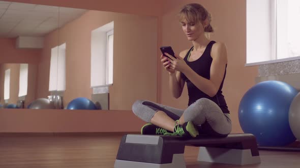 Girl Use Cell for Chatting in Local Club alt