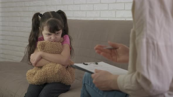 An angry child at a psychologist. alt