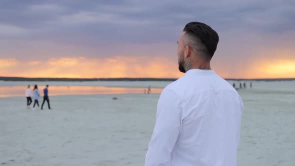 Brutal Man Walking on Beach