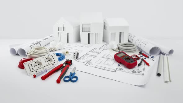 electrical controls for house planning, equipment and electrician work tools on blueprint with model