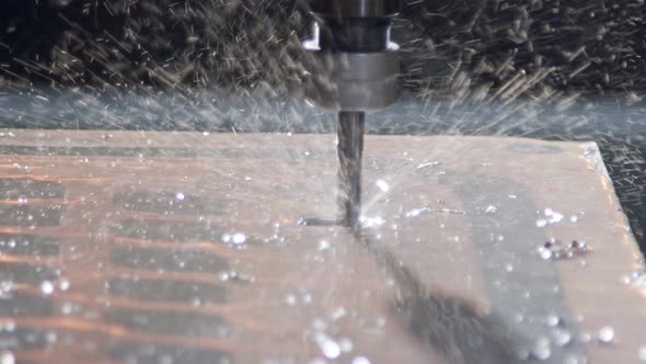 Slow motion of CNC mill manufacturing an advanced metal part