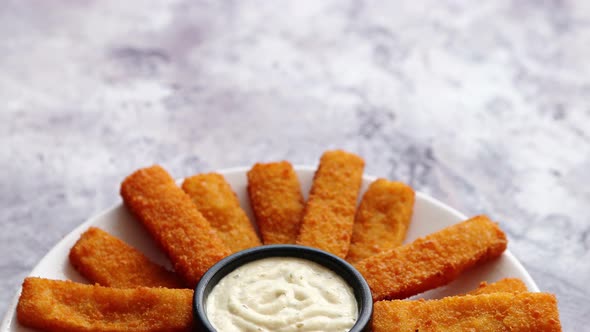 Crumbed Fish Sticks Served with Garlic Dip Sauce alt