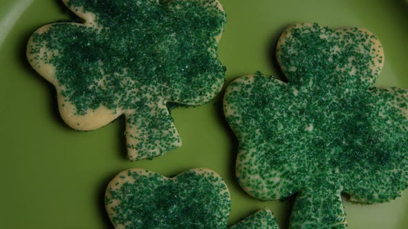 Cinematic, Rotating Shot of Saint Patty's Day Cookies on a Plate  alt