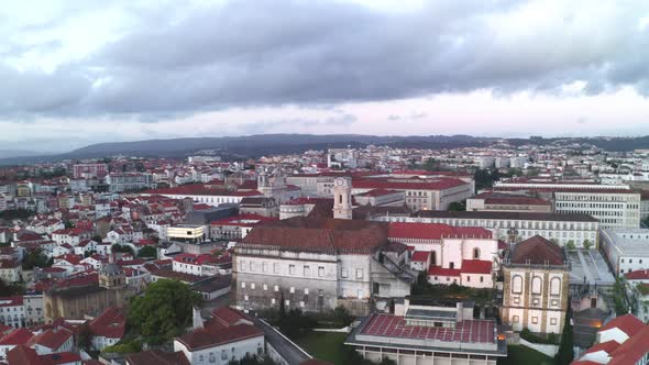 Aerial drone view of Coimbra city and Mondego river at sunset alt