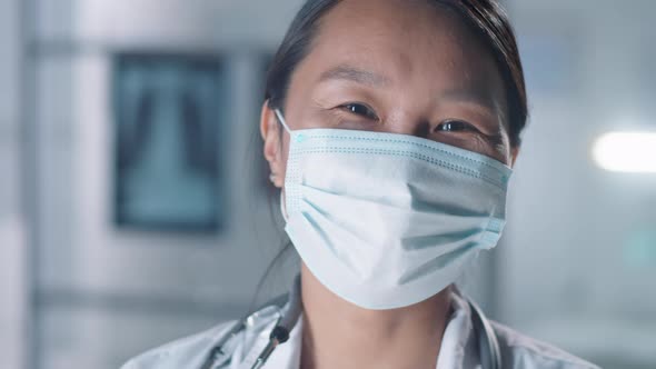 Asian Woman In Mask Smiling alt