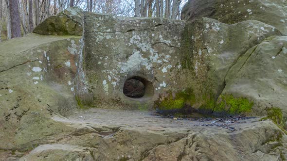 An ancient dolmen from a large megalith with a platform in front of the entrance.