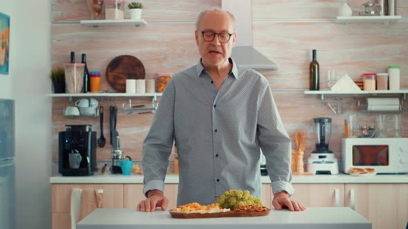 Senior Man Having a Video Call alt