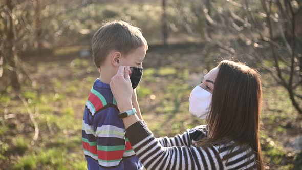 Caring Mother Puts Her Son on a Mask To Protect Against Viruses, Stock ...