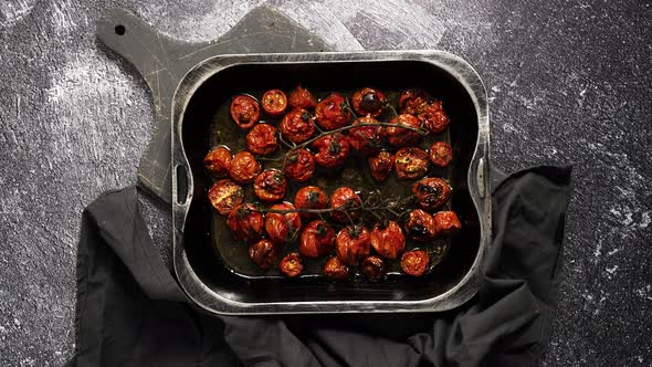 Tray of Roasted Red Cherry Tomatoes with Garlic Herbs and Olive