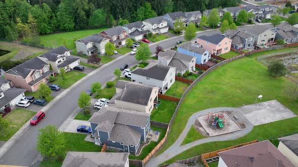 Aerial shot of a suburban neighborhood in America with a private playground. alt