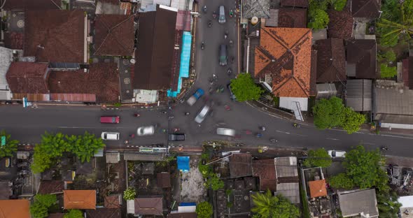 Top Down Overhead Aerial View Timelapse of Busy Rush Hour Traffic at the Intersection in Canggu Bali alt