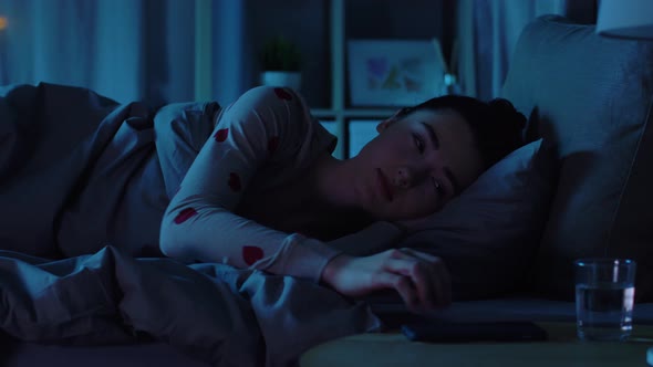 Teenage Girl Awaking Because of Phone at Night alt