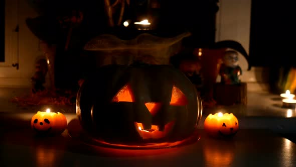 Home Decoration with Spooky Glows Halloween Pumpkin Head Jack Lantern Face and Burning Candle alt