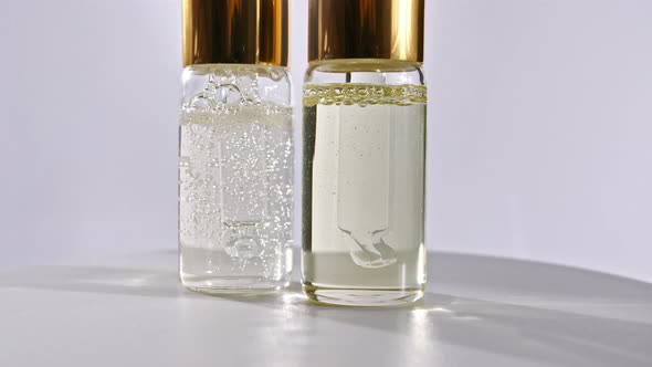 Cosmetic Bottle and Pipette with Essential Oil on White Background alt