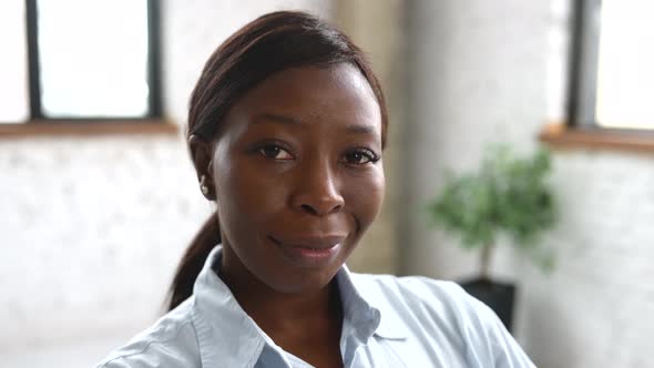 Closeup Portrait of Confident Highskilled AfricanAmerican Female Employee Looking at the Camera