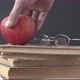 Placing A Ripe Apple On Books Wih Glasses As Sign Of Education - VideoHive Item for Sale