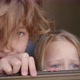 Brother with Junior Sister Looking Out of the Open Window - VideoHive Item for Sale