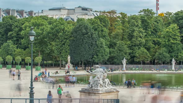 People Relaxing in Tuileries Palace Open Air Park Near Louvre Museum Timelapse alt