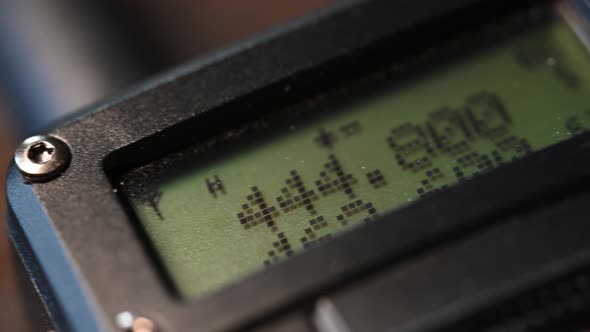 slow slide over a handheld HAM radio from bottom to top alt