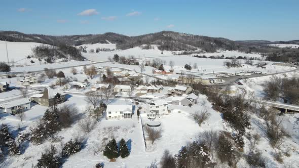 Gorgeous valley landscape view on a bright sunny, cold winter day. Animal tracks in the snow.