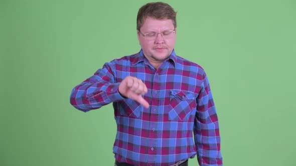Angry Overweight Bearded Hipster Man Giving Thumbs Down alt
