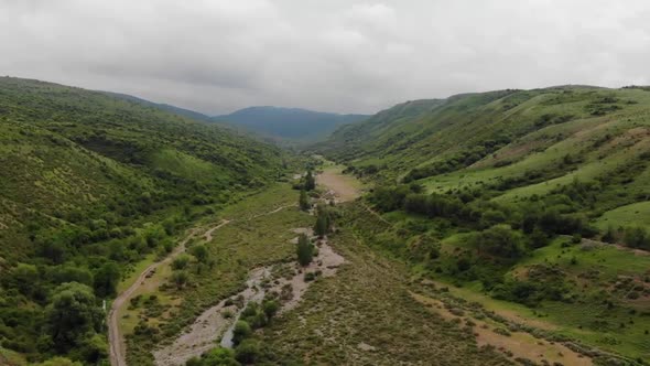Beautiful landscape of green spring mountains. Aerial video.