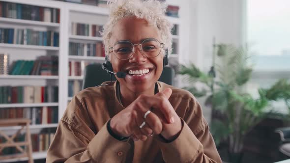 African American Woman Waving with Smile During Video Conference Camera View alt