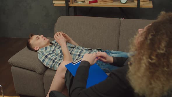 Depressed Man with PTSD Disorder Receiving Professional Help From Psychologist alt