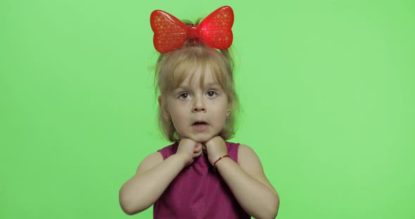 Girl in Purple Dress Dancing and Shows a Finger Forward. Happy Child. Chroma Key alt