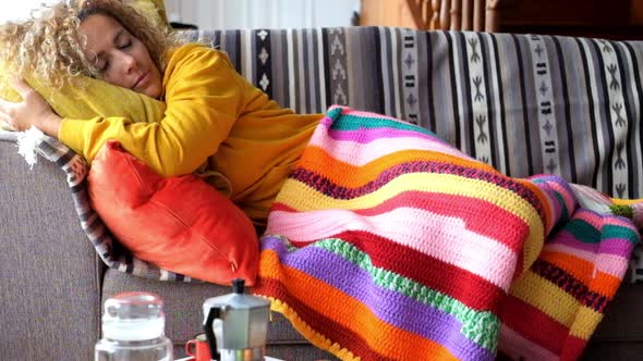 Beautiful adult woman sleep at home on the sofa alt