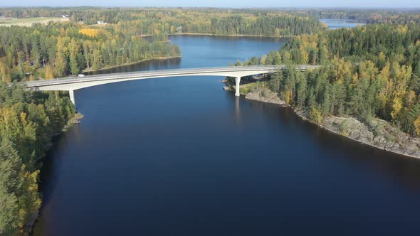 The Blue Water of the Lake Saimaa in Finland with the Long Bridge