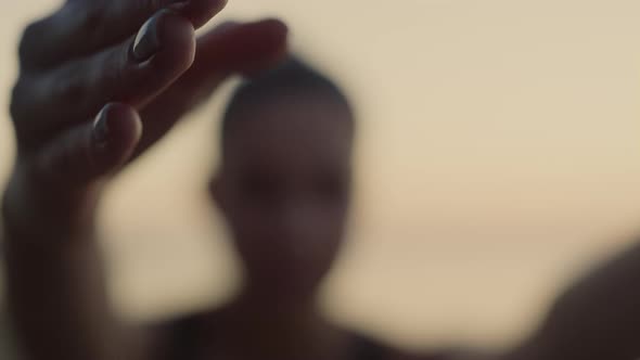 Fit Woman Hold Hands Up Practicing Yoga on Beach Close Up alt