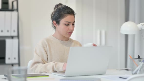Indian Woman with Laptop Drinking Coffee alt