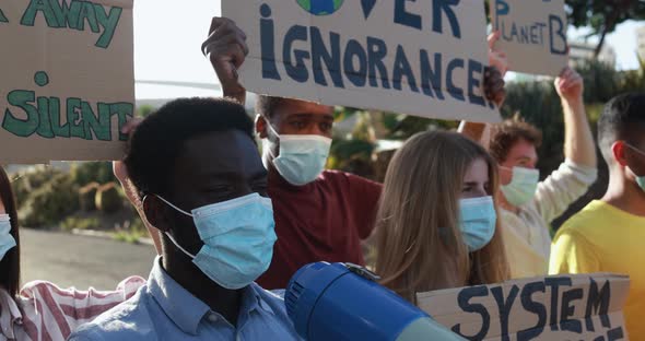 Group of demonstrators on road from different culture and race protest for climate change alt
