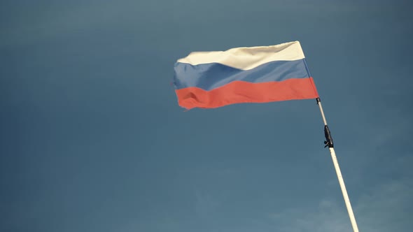 Handheld Shot of Flag Russian Federation Waving Outside