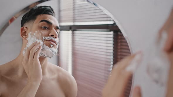 Hispanic Male Bearded Arabian Arab Indian Millennial 30s Man Model Using White Foam Shaving Gel alt