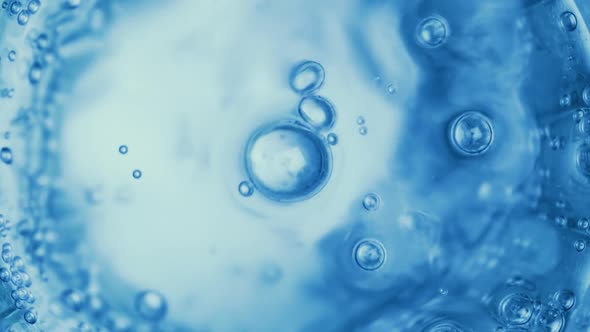 Oxygen Bubbles in Water on a Blue Abstract Background alt