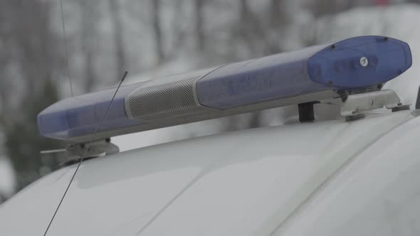 Flashing Flasher on the Roof of a Police Car. Blinker. Close-up. alt