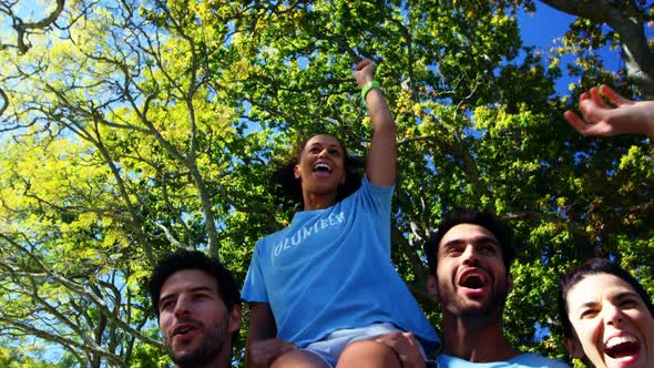 Volunteers having fun in park 4k alt