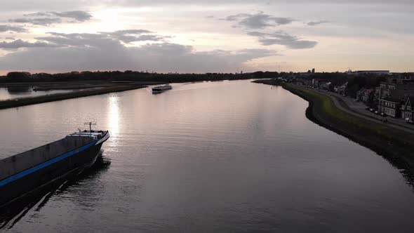 Ship Sailing With Empty Storage Deck Against Sunset Sky In The Waterways Of South Holland In Netherl alt