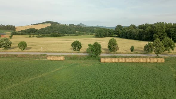 Aerial images of Tuscany in Italy cultivated fields summer,Green fields with mountains in the backgr alt