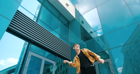 Happy Young Boy Having Fun Outdoor in Street Wearing Glasses, Celebrating Youth, Active Lifestyle alt