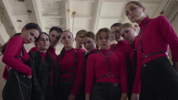 A Crowd of Young Girls and Guys in Same Stage Costumes Emotionally Showing Part of Performance alt