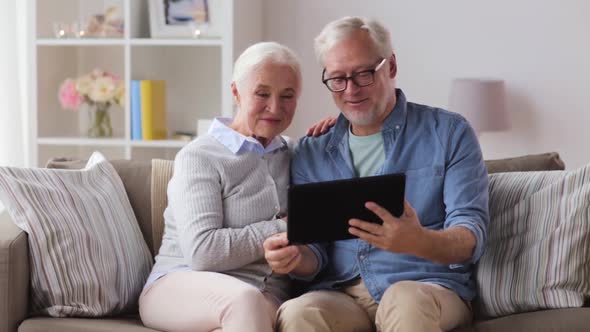 Senior Couple Having Video Call on Tablet Pc alt