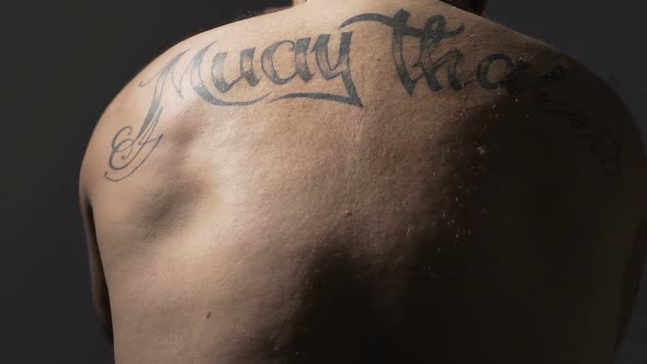 View on Muay Thai Boxer Back With Tattoos Strong Man Training Before Fight alt