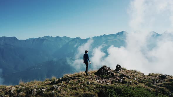 Aerial view; drone moving over young woman alt